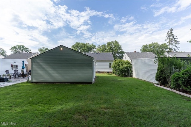 1403 Wexford Ave, Parma, OH 44134 - view of grassy yard featuring a patio and an outdoor structure