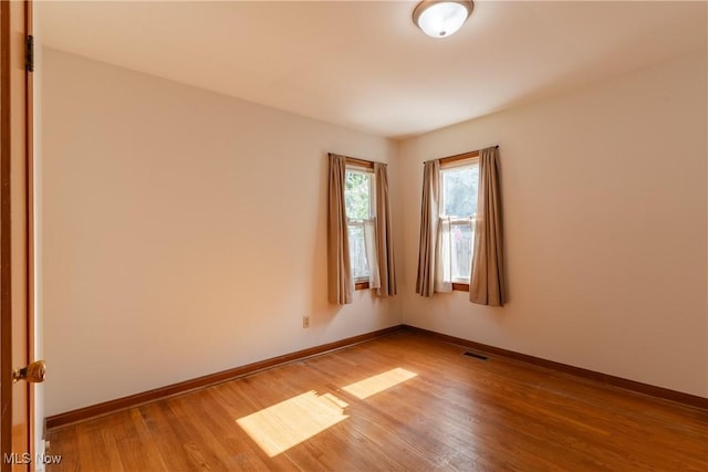 1403 Wexford Ave, Parma, OH 44134 - empty room with light wood-type flooring and baseboards