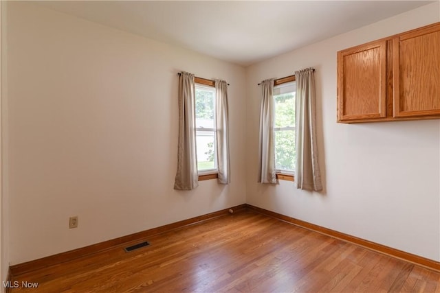 1403 Wexford Ave, Parma, OH 44134 - spare room featuring wood finished floors and baseboards
