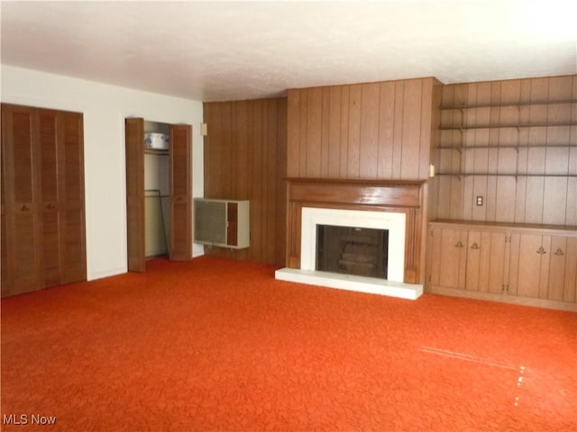 373 E 232nd St, Euclid, OH 44123 - unfurnished living room with a fireplace with raised hearth, carpet floors, and wood walls