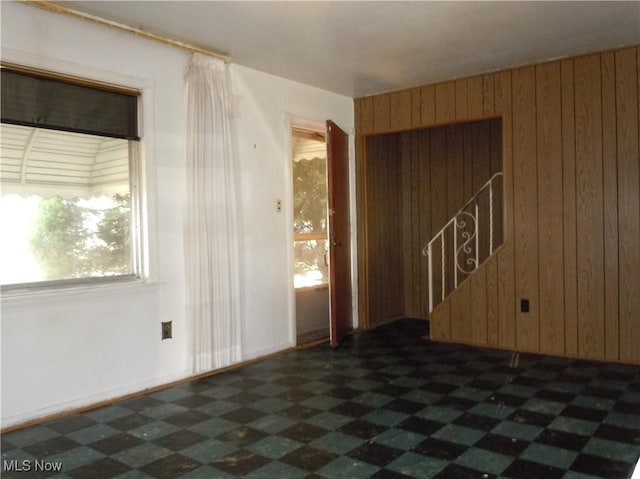 373 E 232nd St, Euclid, OH 44123 - spare room with wooden walls and dark floors