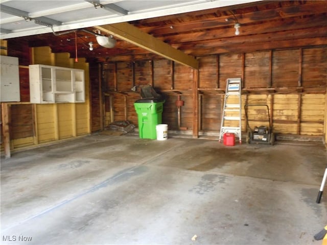 373 E 232nd St, Euclid, OH 44123 - garage with wooden walls and a garage door opener