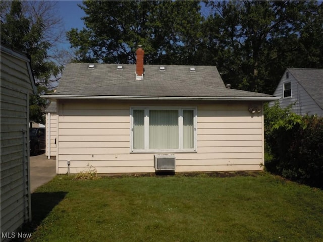 373 E 232nd St, Euclid, OH 44123 - rear view of property featuring a yard and a chimney