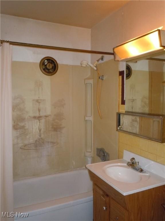 373 E 232nd St, Euclid, OH 44123 - bathroom featuring shower / bath combination with curtain, vanity, and decorative backsplash