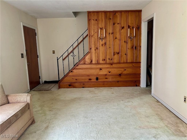 330 Inwood Blvd, Avon Lake, OH 44012 - unfurnished living room featuring carpet floors and stairs