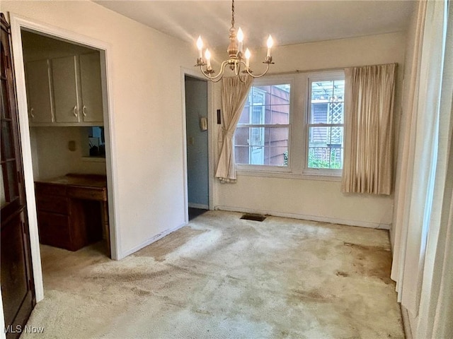 330 Inwood Blvd, Avon Lake, OH 44012 - unfurnished dining area featuring a chandelier and carpet