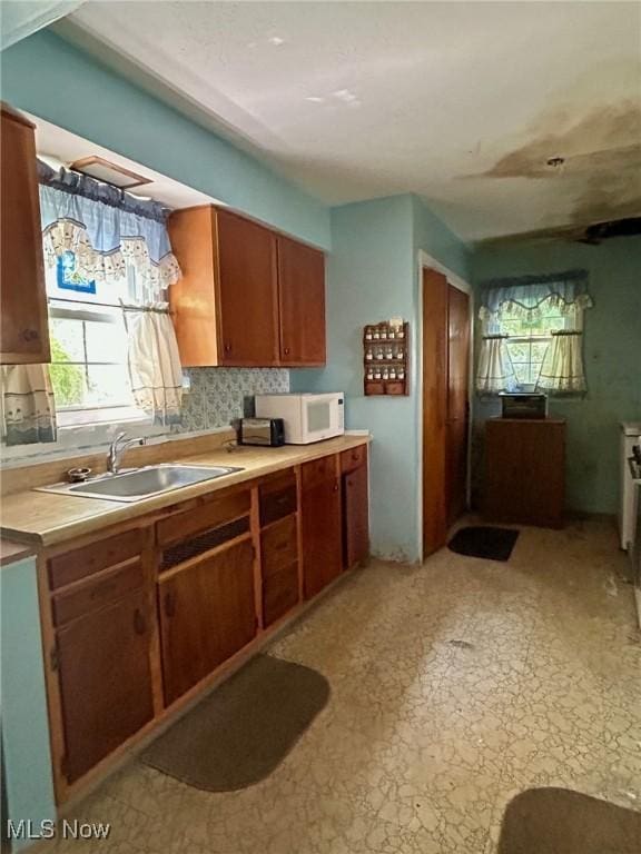 330 Inwood Blvd, Avon Lake, OH 44012 - kitchen with white microwave, healthy amount of natural light, light countertops, and light floors
