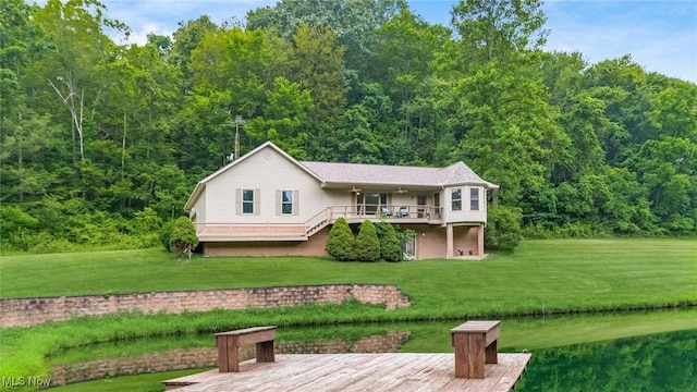 4101 Oak Ridge Ln, Cambridge, OH 43725 - view of front of house with stairs, a front lawn, a forest view, and a deck