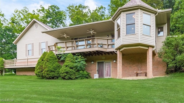 4101 Oak Ridge Ln, Cambridge, OH 43725 - back of house with a lawn, a wooden deck, ceiling fan, and brick siding
