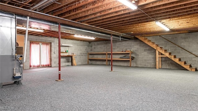 4101 Oak Ridge Ln, Cambridge, OH 43725 - below grade area with stairs, heating unit, and concrete block wall