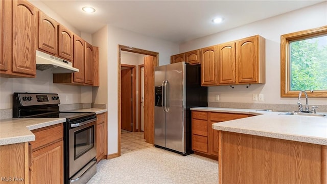 4101 Oak Ridge Ln, Cambridge, OH 43725 - kitchen with appliances with stainless steel finishes, under cabinet range hood, light countertops, light flooring, and recessed lighting