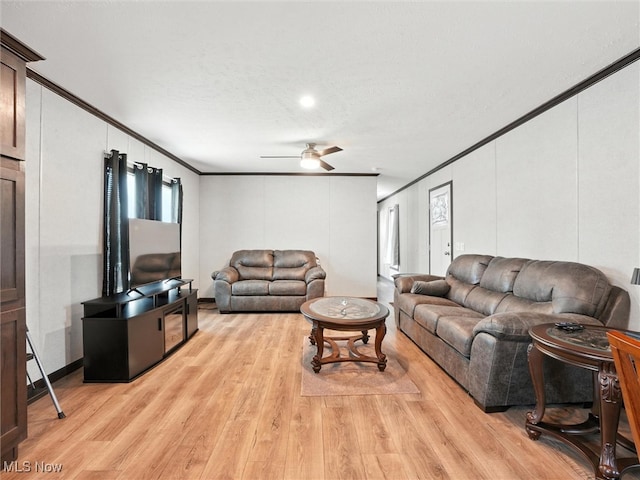 187 Garfield Ln, Jefferson, OH 44047 - living area with ornamental molding, light wood finished floors, ceiling fan, and a decorative wall
