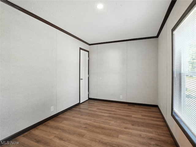 187 Garfield Ln, Jefferson, OH 44047 - unfurnished room featuring ornamental molding and wood finished floors