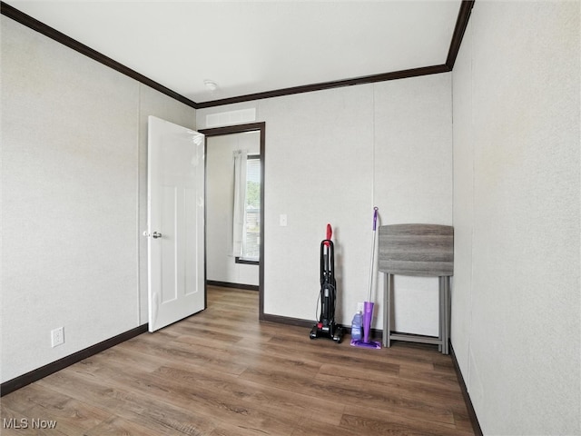 187 Garfield Ln, Jefferson, OH 44047 - unfurnished bedroom with crown molding and wood finished floors