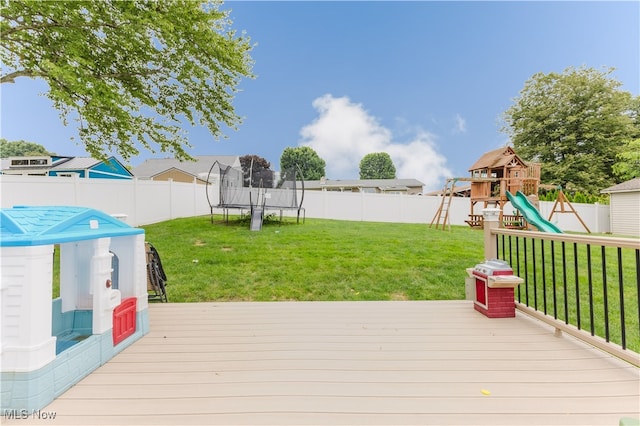32 Par Three Dr, Follansbee, WV 26037 - wooden terrace featuring a trampoline, a playground, and a fenced backyard