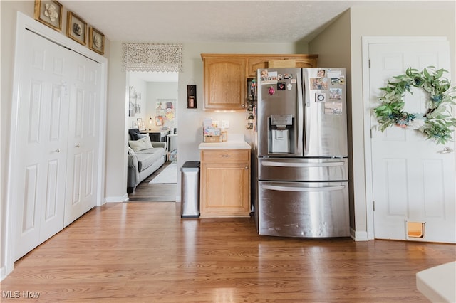 32 Par Three Dr, Follansbee, WV 26037 - kitchen featuring stainless steel fridge, light wood-type flooring, and light countertops