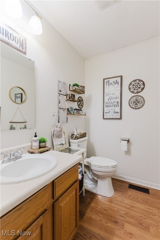 32 Par Three Dr, Follansbee, WV 26037 - half bathroom featuring vanity and wood finished floors