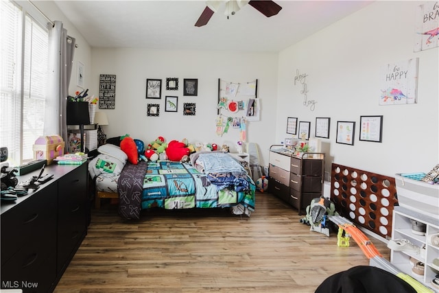 32 Par Three Dr, Follansbee, WV 26037 - bedroom featuring wood finished floors, multiple windows, and a ceiling fan