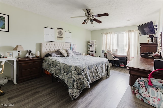 32 Par Three Dr, Follansbee, WV 26037 - bedroom featuring dark wood-style floors, a textured ceiling, a desk, and a ceiling fan