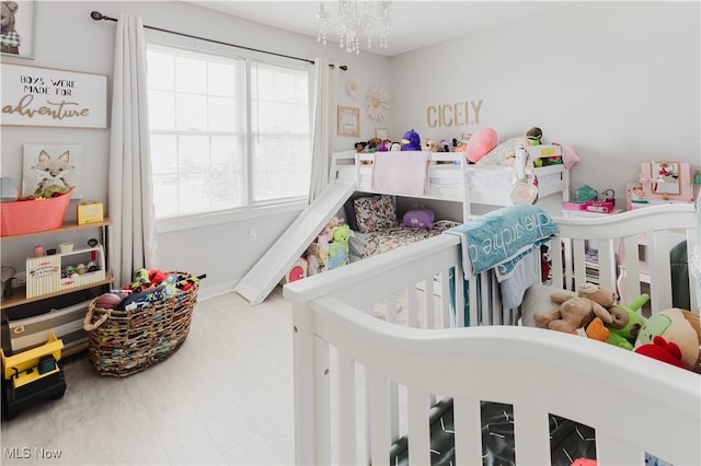 32 Par Three Dr, Follansbee, WV 26037 - bedroom featuring a crib and a chandelier
