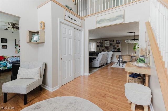 32 Par Three Dr, Follansbee, WV 26037 - foyer entrance with a ceiling fan, wood finished floors, stairway, and a high ceiling