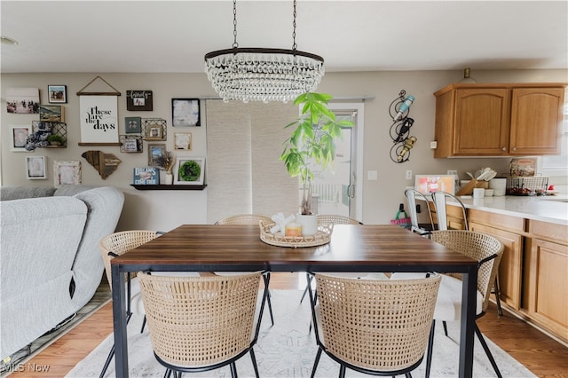 32 Par Three Dr, Follansbee, WV 26037 - dining room featuring a chandelier and light wood-type flooring