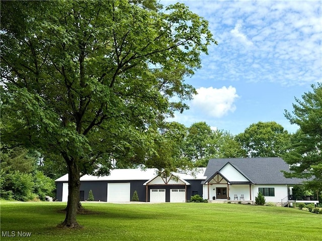 2710 E Hutton Rd, Wooster, OH 44691 - view of front facade with a front yard and a garage