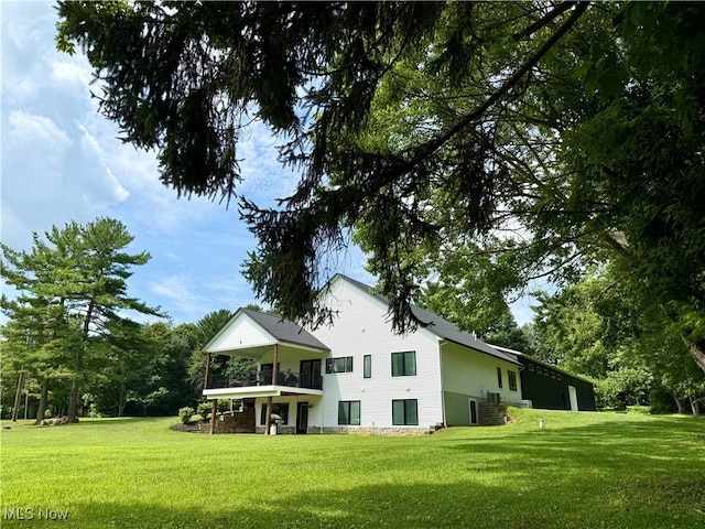 2710 E Hutton Rd, Wooster, OH 44691 - back of property featuring a lawn and a balcony