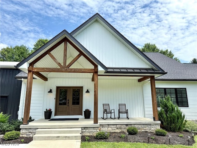 2710 E Hutton Rd, Wooster, OH 44691 - view of front of property with a porch, a standing seam roof, a metal roof, and a shingled roof