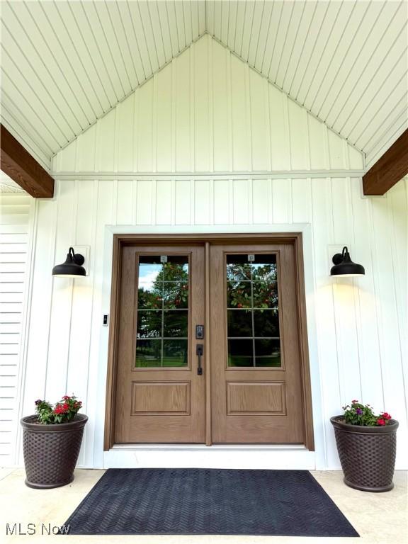 2710 E Hutton Rd, Wooster, OH 44691 - doorway to property featuring board and batten siding