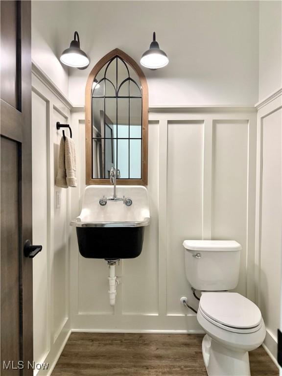 2710 E Hutton Rd, Wooster, OH 44691 - bathroom with a decorative wall and wood finished floors