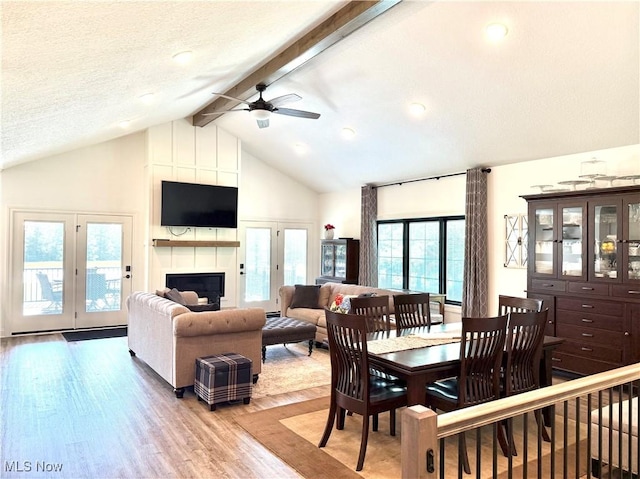 2710 E Hutton Rd, Wooster, OH 44691 - living area with light wood finished floors, beamed ceiling, ceiling fan, high vaulted ceiling, and a large fireplace
