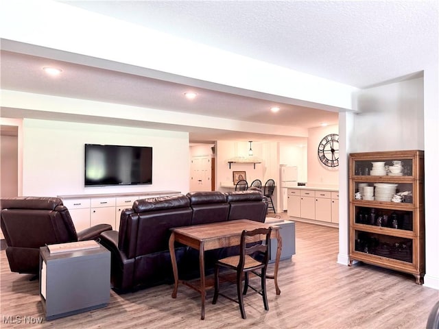 2710 E Hutton Rd, Wooster, OH 44691 - living room featuring light wood-type flooring, recessed lighting, and a textured ceiling