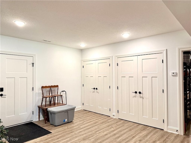 2710 E Hutton Rd, Wooster, OH 44691 - entryway featuring light wood-style flooring, a textured ceiling, and recessed lighting