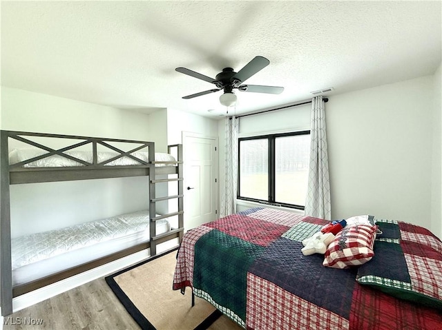 2710 E Hutton Rd, Wooster, OH 44691 - bedroom with wood finished floors, ceiling fan, and a textured ceiling