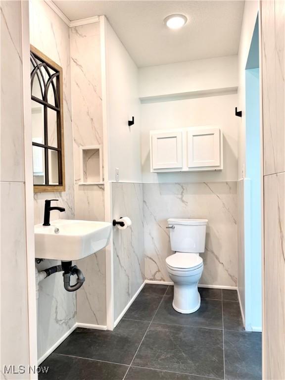 2710 E Hutton Rd, Wooster, OH 44691 - bathroom featuring toilet and tile walls