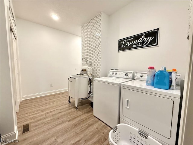 2710 E Hutton Rd, Wooster, OH 44691 - laundry room with washing machine and clothes dryer, light wood-style floors, and recessed lighting