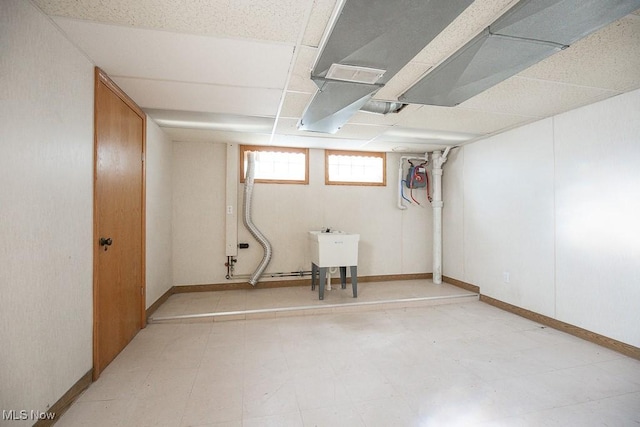 4435 W 58th St, Cleveland, OH 44144 - basement featuring tile patterned floors and a drop ceiling