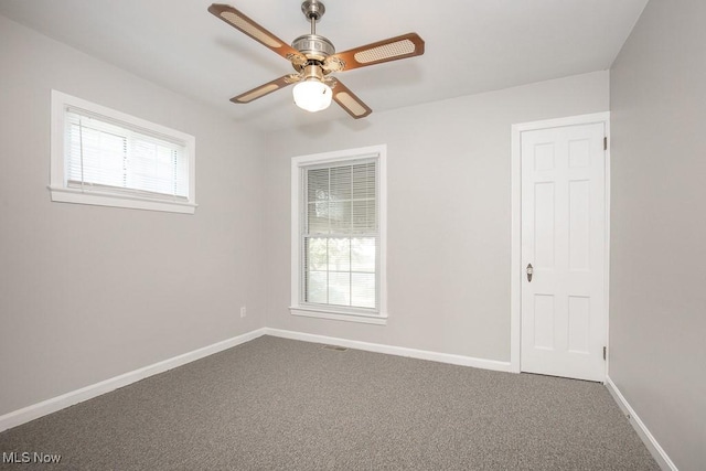 4435 W 58th St, Cleveland, OH 44144 - unfurnished room with a ceiling fan and dark colored carpet