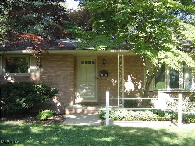 1275 NW Janet Ave, North Canton, OH 44720 - doorway to property featuring brick siding