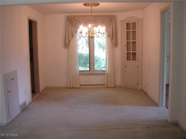 1275 NW Janet Ave, North Canton, OH 44720 - unfurnished dining area featuring a chandelier and light colored carpet