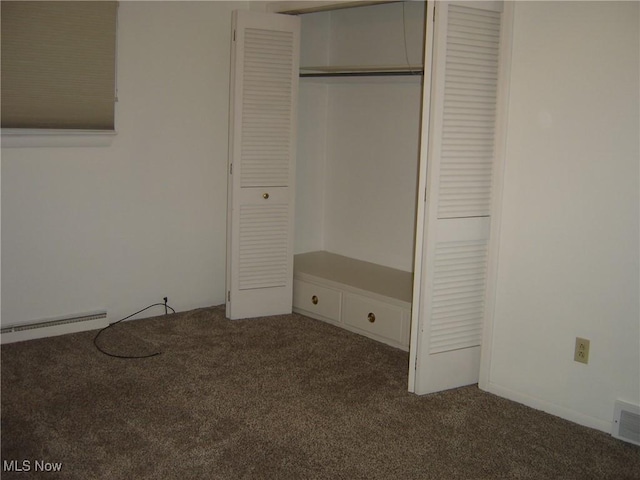 1275 NW Janet Ave, North Canton, OH 44720 - unfurnished bedroom featuring carpet flooring, baseboard heating, and a closet