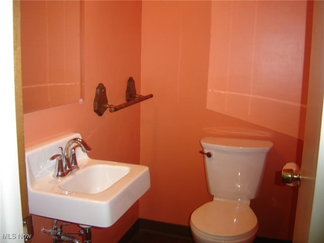 1275 NW Janet Ave, North Canton, OH 44720 - half bath featuring a sink and toilet