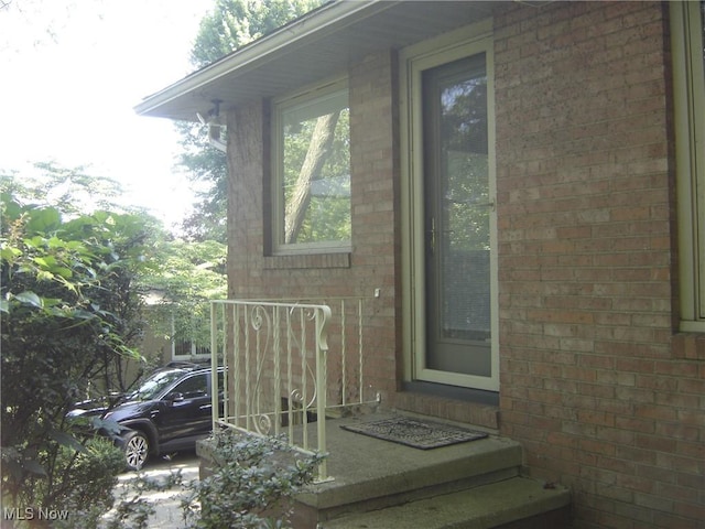 1275 NW Janet Ave, North Canton, OH 44720 - doorway to property featuring brick siding