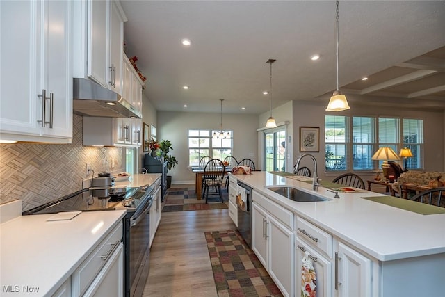 34674 N Legends Way, Grafton, OH 44044 - kitchen featuring range with electric cooktop, under cabinet range hood, recessed lighting, tasteful backsplash, and white cabinetry