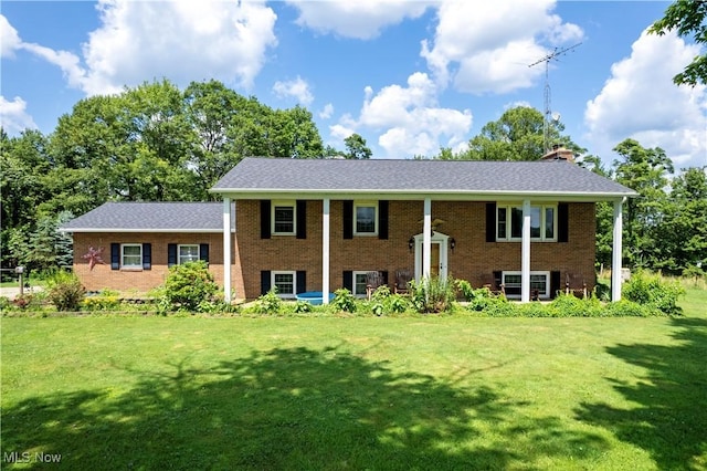 1292 Cinder Rd SE, Bergholz, OH 43908 - bi-level home featuring a front yard, brick siding, and a chimney