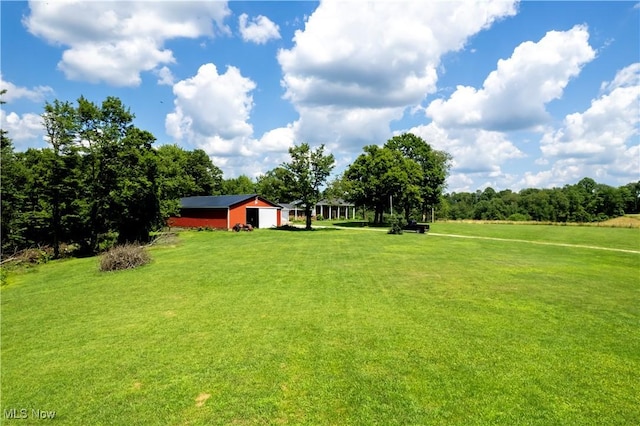 1292 Cinder Rd SE, Bergholz, OH 43908 - view of grassy yard featuring a pole building, an outbuilding, and a detached garage