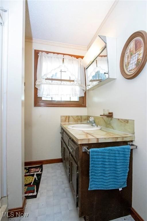 1292 Cinder Rd SE, Bergholz, OH 43908 - bathroom with vanity, tile patterned floors, and crown molding