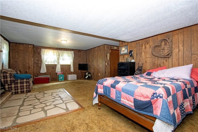 1292 Cinder Rd SE, Bergholz, OH 43908 - carpeted bedroom with wooden walls and a textured ceiling