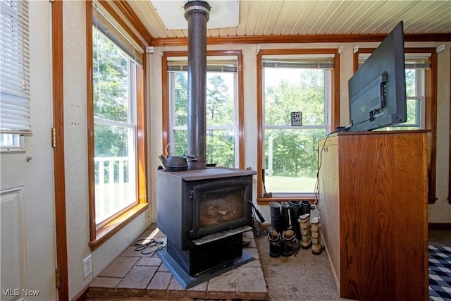 1292 Cinder Rd SE, Bergholz, OH 43908 - detailed view of a wood stove and wooden ceiling